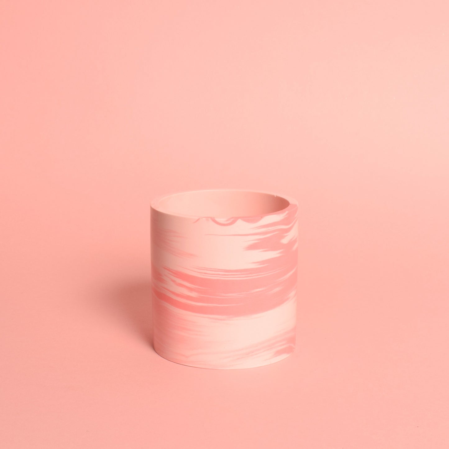 A marble effect pink multiuse pot