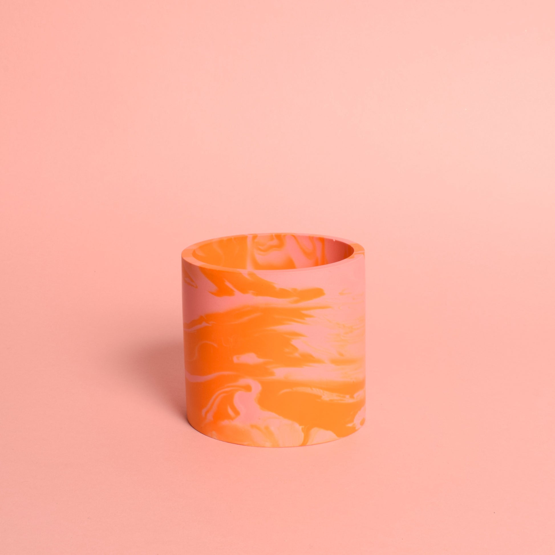 A marble effects pink and orange multi-use pot.