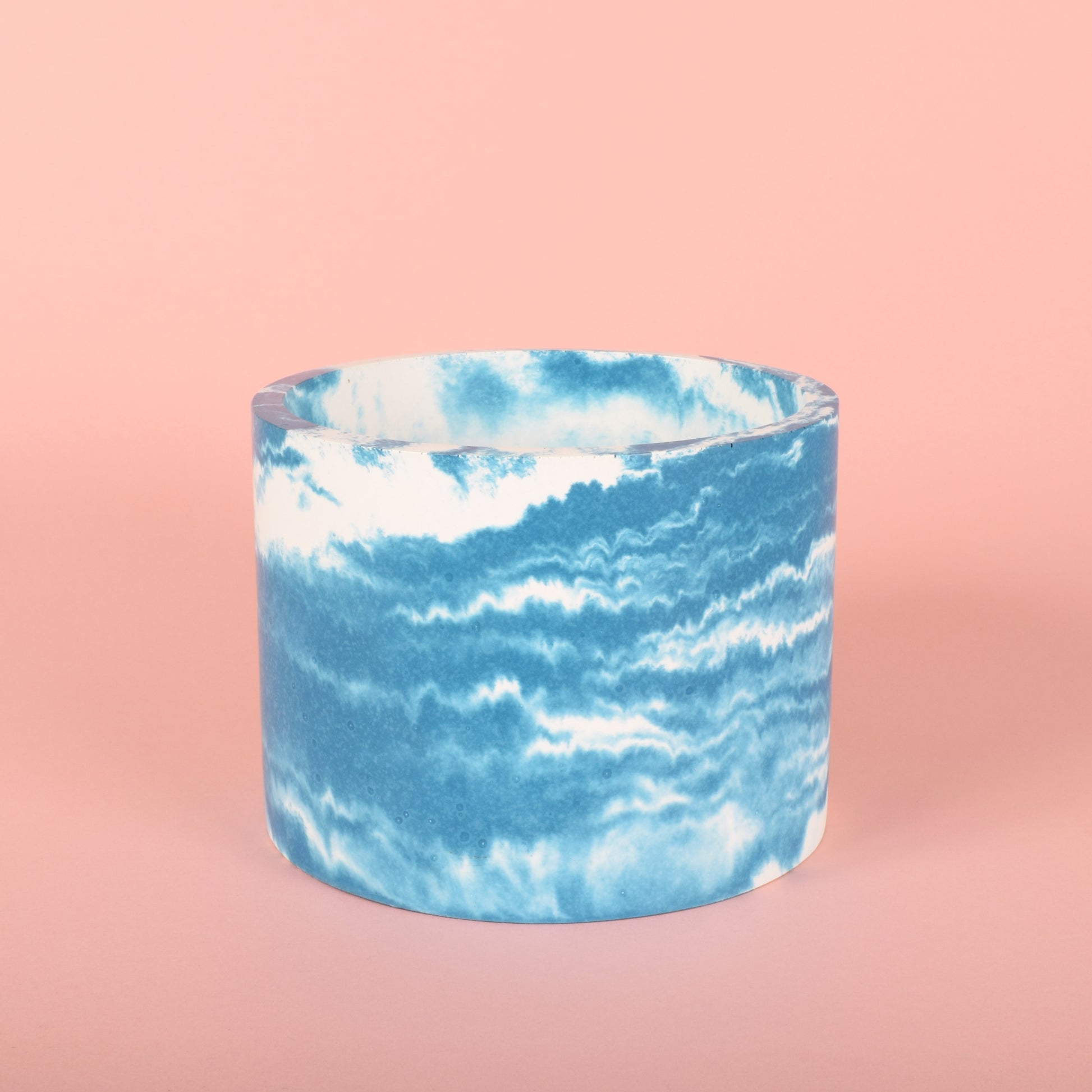 A blue and white cloudy medium-sized houseplant pot.