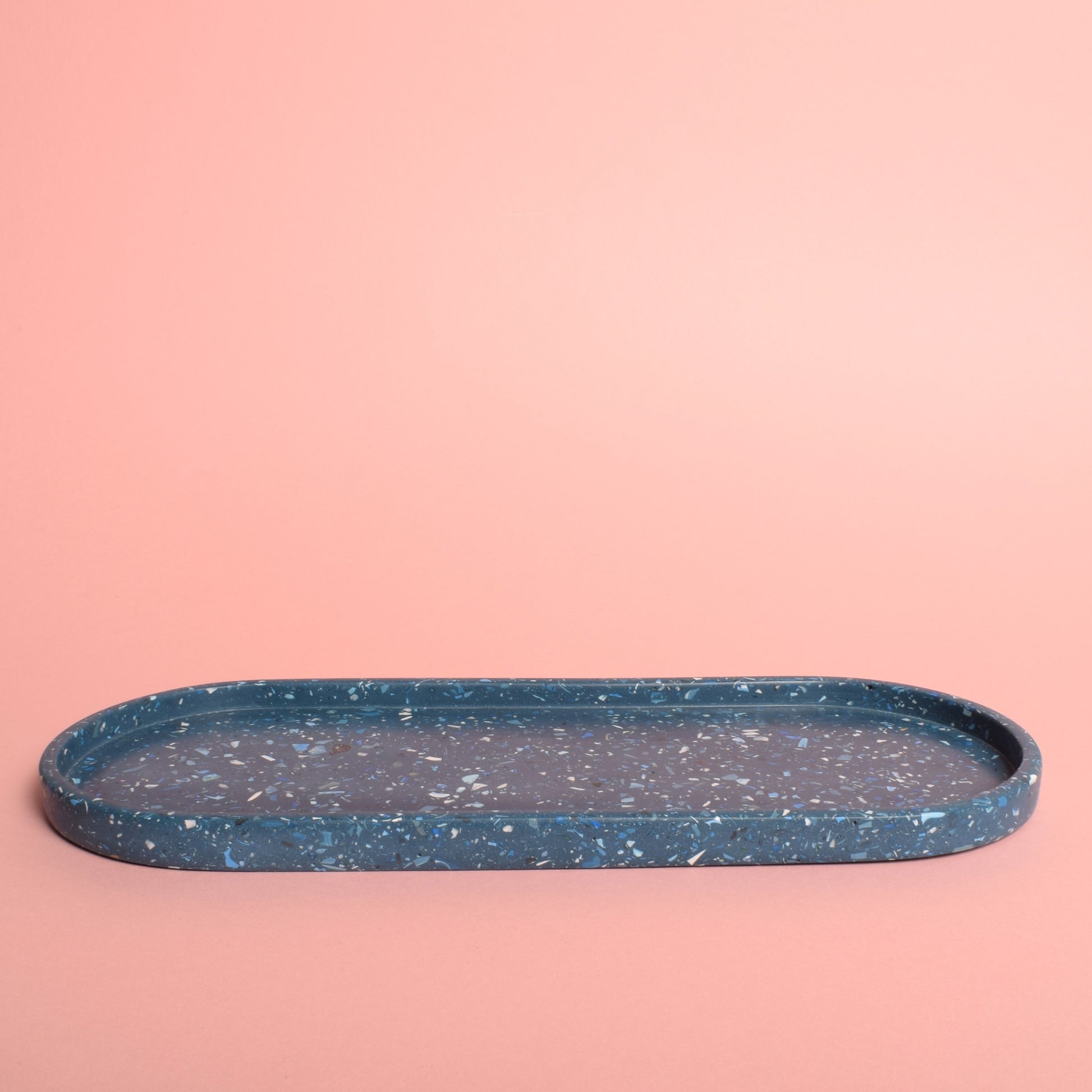 A large oval blue terrazzo trinket tray.